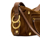 Close-up of a brown suede shoulder bag with tan leather trim, gold-tone hardware, and two large interlocking ring charms on a white background.