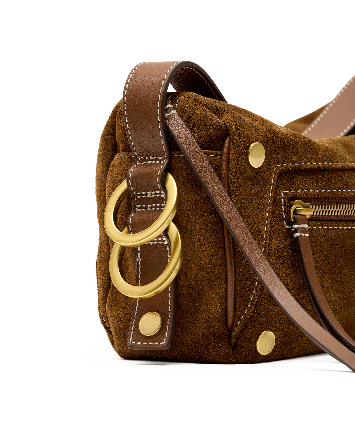 Close-up of a brown suede shoulder bag with tan leather trim, gold-tone hardware, and two large interlocking ring charms on a white background.