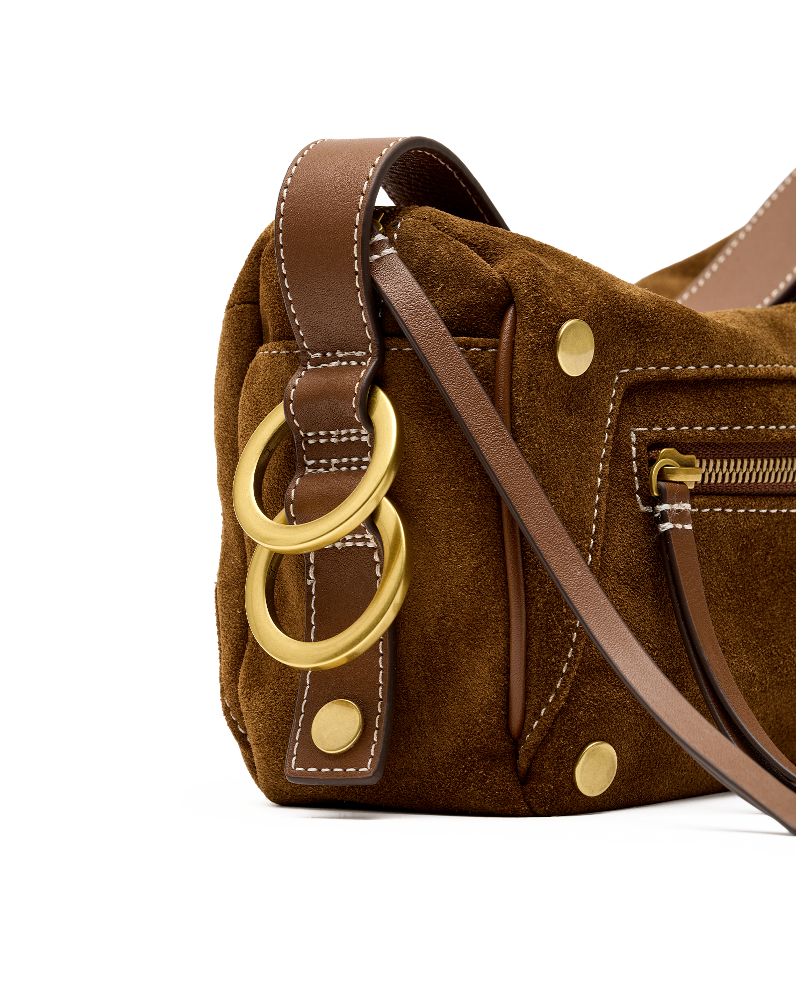 Close-up of a brown suede shoulder bag with tan leather trim, gold-tone hardware, and two large interlocking ring charms on a white background.