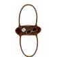 A brown leather handbag shown from a top-down view, containing sunglasses and a small white accessory, set against a plain white background.