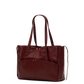 A dark burgundy leather tote bag with dual shoulder straps, a front slip pocket, and small gold-tone hardware, shown on a plain white background.