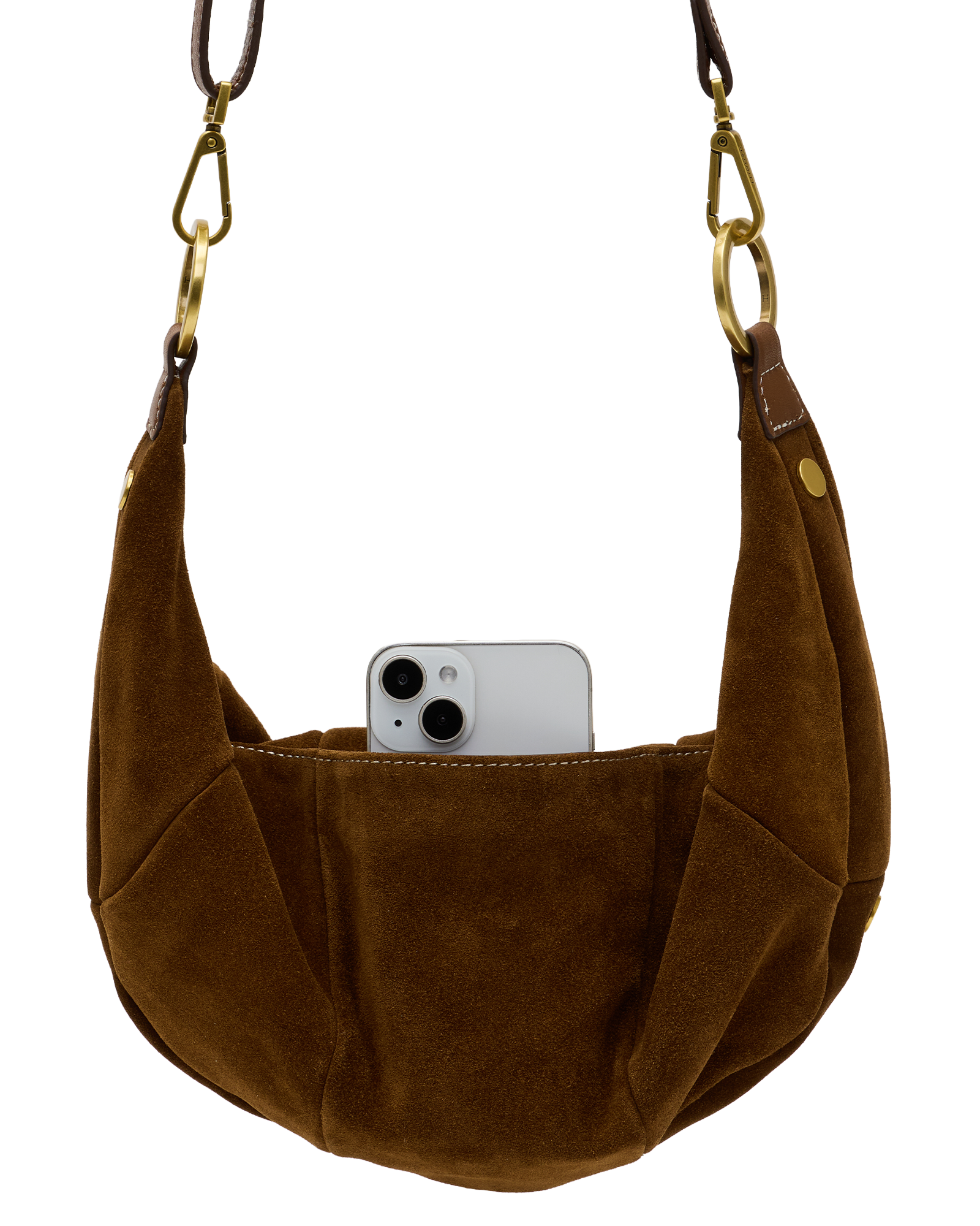A brown suede crescent shoulder bag with gold-tone hardware and a white smartphone partially tucked into its front slip pocket, shown against a plain white background.