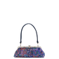 A small handbag with a dark navy blue handle and a colorful floral patterned body in shades of purple, blue, orange, and green, featuring a silver-tone kiss-lock closure.