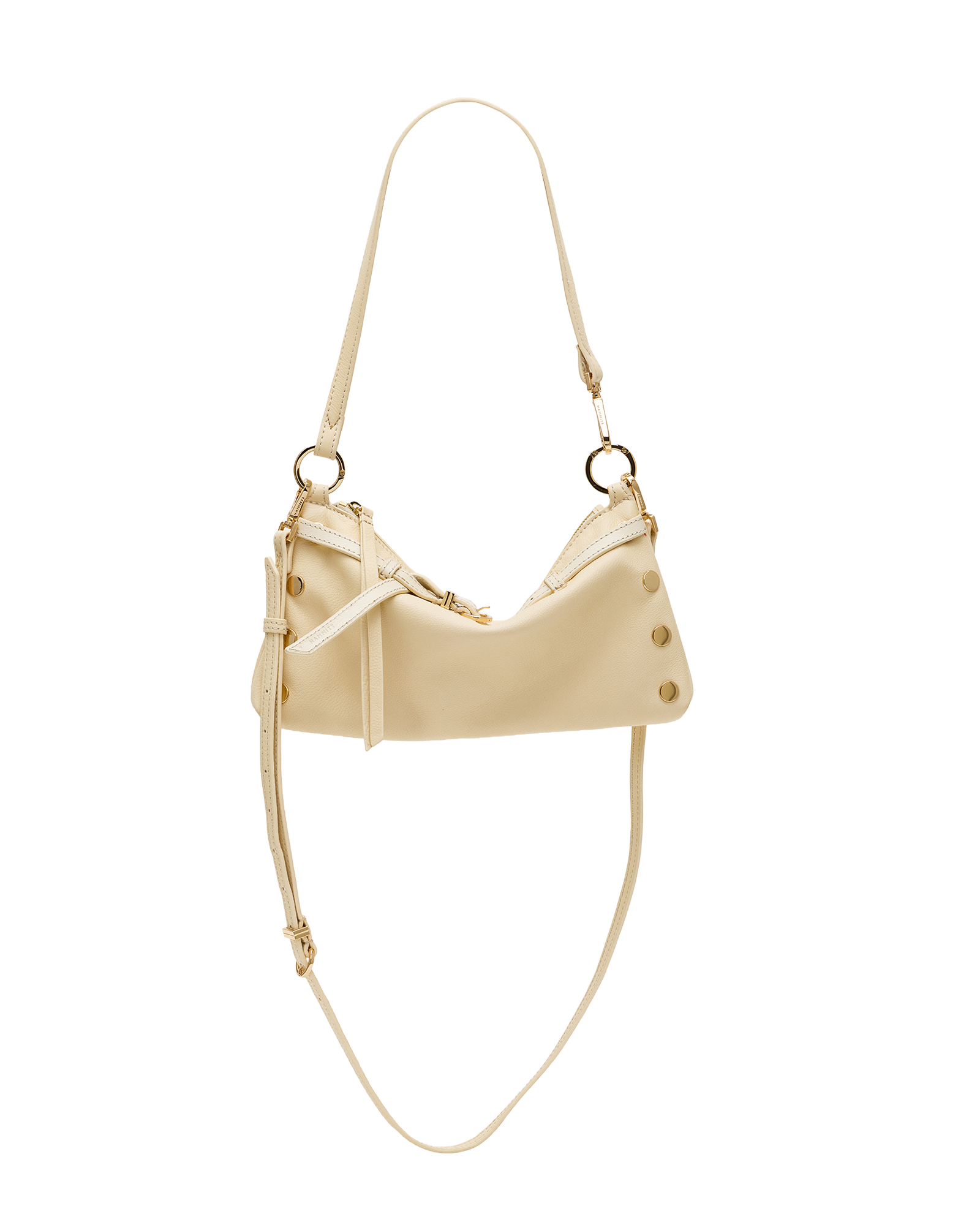 A cream-colored faux leather shoulder bag with gold-tone hardware, featuring a crescent-shaped body, decorative studs, and a long thin strap, shown against a plain white background.