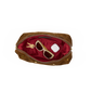 A brown suede cosmetic pouch shown open from above, revealing a deep red satin interior with sunglasses, keys, and a small white item inside. The pouch has gold-tone hardware and is photographed on a plain white background.