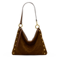 A brown suede slouchy shoulder bag with gold-tone metal studs and a matching brown leather strap, shown against a plain white background.