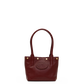 A dark burgundy leather tote bag with double top handles, gold-tone hardware, and an embossed oval logo on the front, shown against a plain white background.
