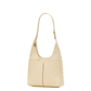 A light beige leather shoulder bag with a single strap and gold-tone hardware, shown against a plain white background.