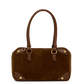 A brown suede and leather handbag with gold-tone hardware, featuring dual top handles, a structured rectangular body, and decorative brass studs on a plain white background.