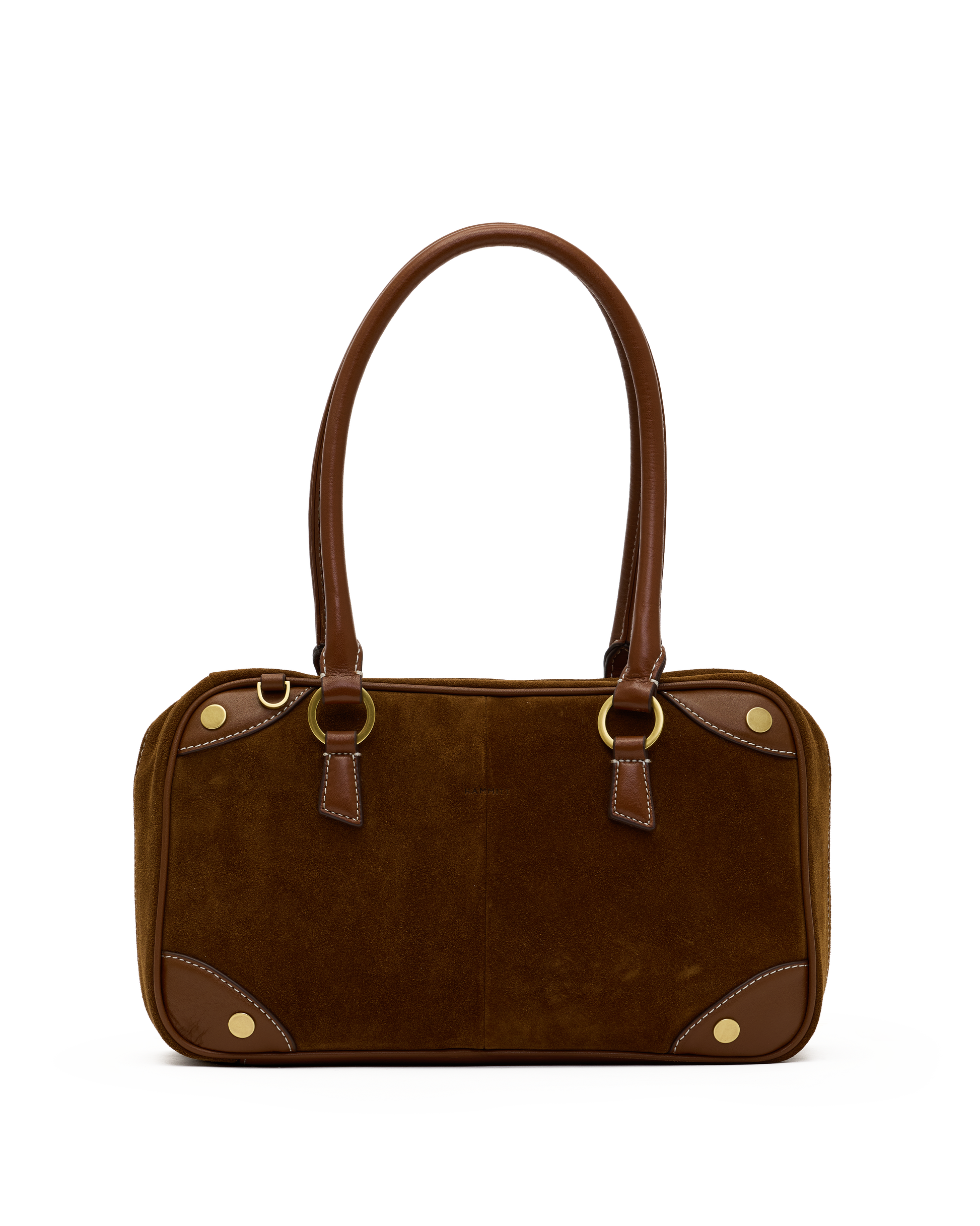 A brown suede and leather handbag with gold-tone hardware, featuring dual top handles, a structured rectangular body, and decorative brass studs on a plain white background.