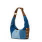 Blue denim handbag with brown leather accents on a white background