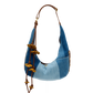 Blue and brown handbag with decorative elements on a white background
